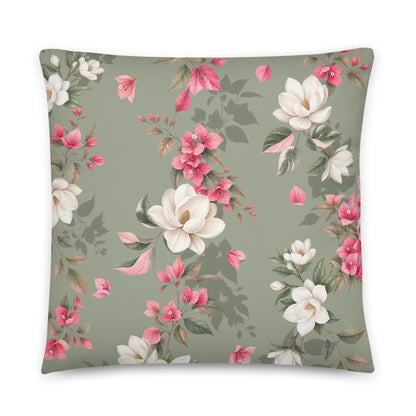 Decorative floral pillow with muted green and warm earth tones
